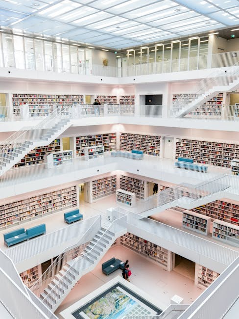 Spacious, multi-level library interior in Stuttgart, featuring contemporary design and bookshelves.